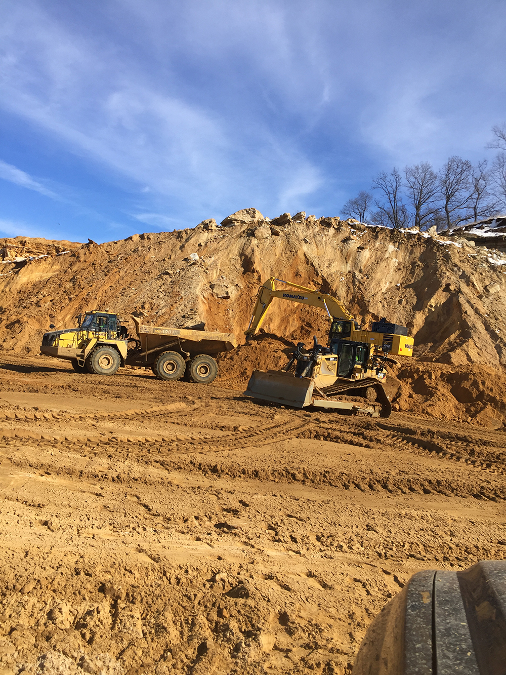 Heavy equipment working in a large excavation