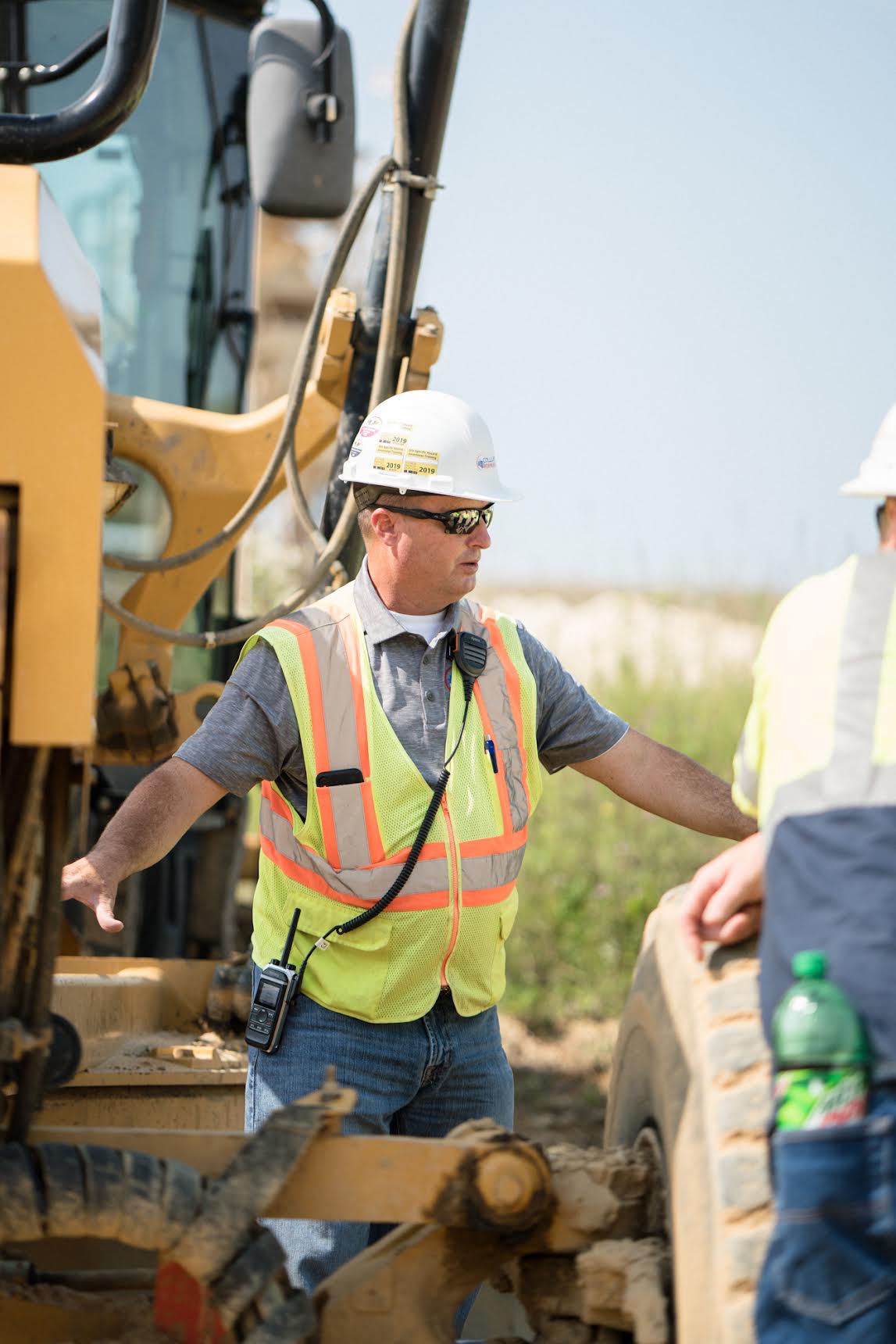 Jay Collup leading heavy equipment operator training in the field